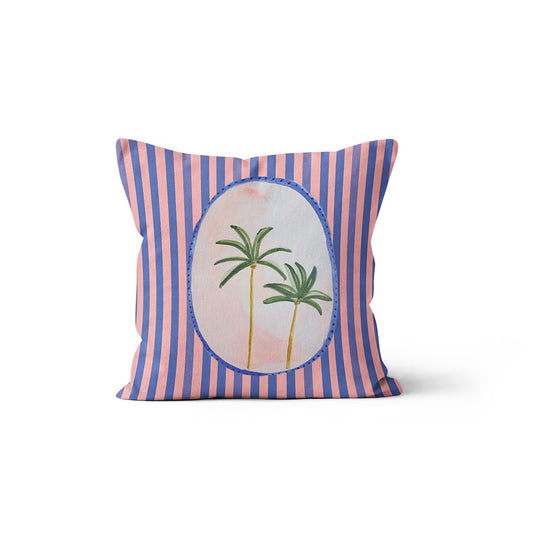 Coussin à rayures bleues et roses avec motif de palmiers dans un médaillon, collection Coast & Valley