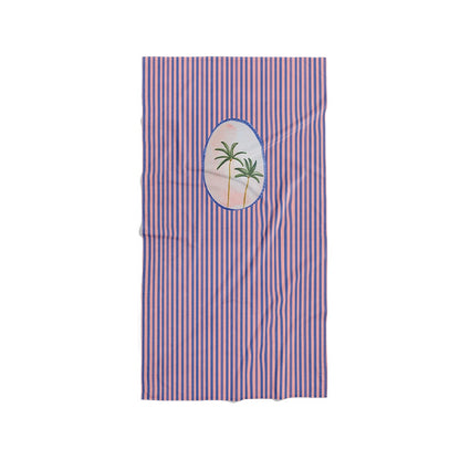 Serviette de plage à rayures bleues et roses avec motif de palmiers dans un médaillon